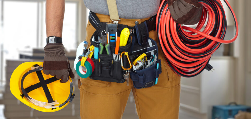 Electrician,with,construction,tools,and,cable.